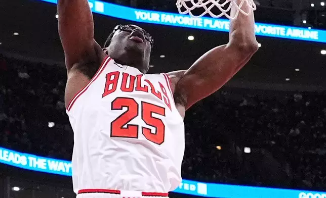 Chicago Bulls forward/center Jalen Smith dunks against the Houston Rockets during the first half of an NBA basketball game in Chicago, Monday, March 23, 2026. (AP Photo/Nam Y. Huh)