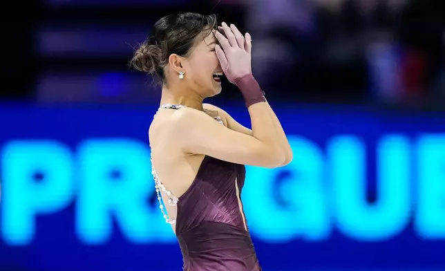 Kaori Sakamoto from Japan reacts at the end of her routine during the women free skating at the Figure Skating World Championships in Prague, Czech Republic, Friday, March 27, 2026. (AP Photo/Petr David Josek)