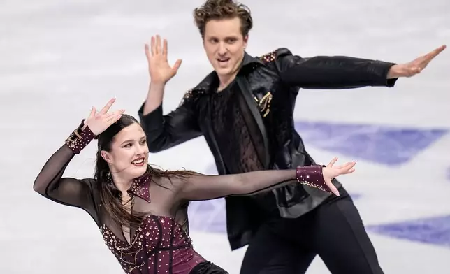 Christina Carreira and Anthony Ponomarenko from the United States perform during the ice dance rhythm dance at the Figure Skating World Championships in Prague, Czech Republic, Friday, March 27, 2026. (AP Photo/Petr David Josek)
