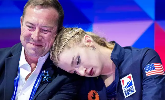 Amber Glenn from the United States reacts at the end of her routine during the women free skating at the Figure Skating World Championships in Prague, Czech Republic, Friday, March 27, 2026. (AP Photo/Petr David Josek)