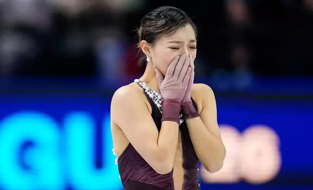 Kaori Sakamoto from Japan reacts at the end of her routine during the women free skating at the Figure Skating World Championships in Prague, Czech Republic, Friday, March 27, 2026. (AP Photo/Petr David Josek)