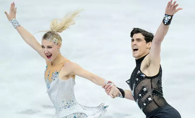 Piper Gilles and Paul Poirier from Canada perform during the ice dance rhythm dance at the Figure Skating World Championships in Prague, Czech Republic, Friday, March 27, 2026. (AP Photo/Petr David Josek)