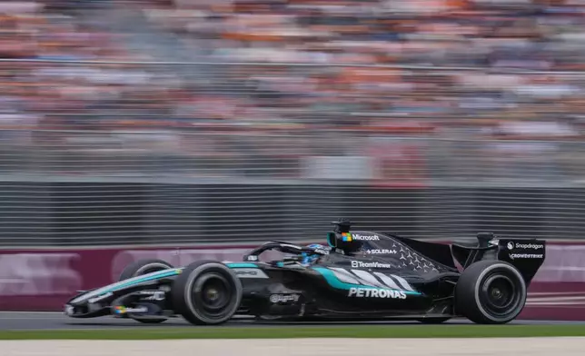 Mercedes driver George Russell of Britain steers his car during the Australian Formula One Grand Prix at Albert Park, in Melbourne, Australia, Sunday, March 8, 2026. (AP Photo/Heath McKinley )