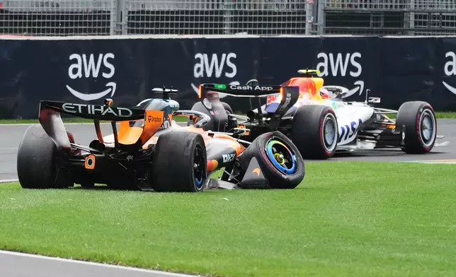 McLaren driver Oscar Piastri of Australia's car sits on the track after he crashed during the formation lap ahead of the Australian Formula One Grand Prix at Albert Park, in Melbourne, Australia, Sunday, March 8, 2026. (AP Photo/Scott Barbour)