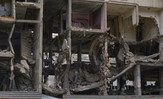 A view of a building damaged in an Israeli airstrike, in Dahiyeh, Beirut's southern suburbs, Beirut's southern suburbs, Lebanon, Monday, March 16, 2026. (AP Photo/Bilal Hussein)