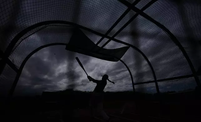 A player hits during a Women's Pro Baseball League (WPBL) practice, Wednesday, March 18, 2026, in Fort Myers, Fla. (AP Photo/Rebecca Blackwell)