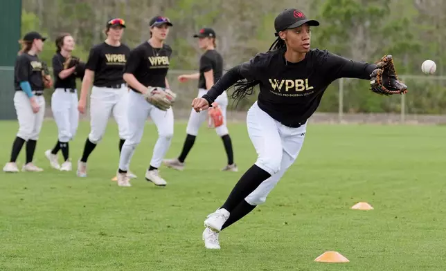 Mo'ne Davis fields a ball during a Women's Pro Baseball League (WPBL) practice, Wednesday, March 18, 2026, in Fort Myers, Fla. (AP Photo/Rebecca Blackwell)