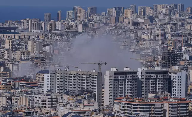 Smoke rises from Israeli airstrikes on Dahiyeh, a southern suburb of Beirut, Lebanon, Monday, March 2, 2026. (AP Photo/Hassan Ammar)