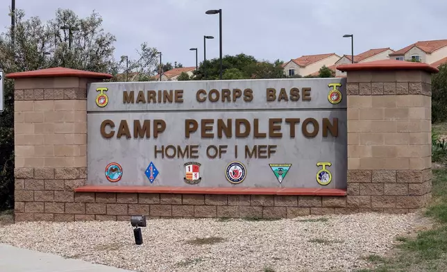 FILE - The entrance to Marine Corps base Camp Pendleton is seen on Sept. 22, 2015, in Oceanside, Calif. (AP Photo/Gregory Bull, File)
