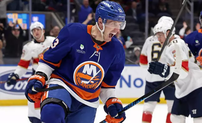 New York Islanders center Casey Cizikas reacts after scoring a goal in the second period of an NHL hockey game against the Florida Panthers, Saturday, March 28, 2026, in Elmont, N.Y. (AP Photo/Adam Hunger)
