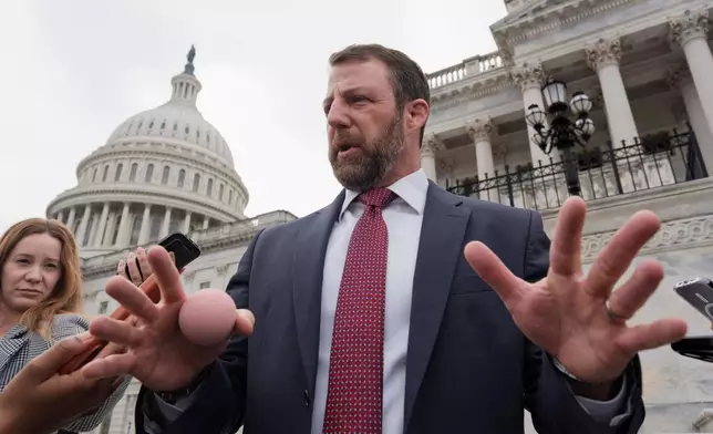 Sen. Markwayne Mullin, R-Okla., speaks with reporters on the steps at the Capitol in Washington, Thursday, March 5, 2026. (AP Photo/J. Scott Applewhite)