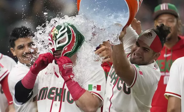 Mexico's Julian Ornelas celebrates after hitting a walk off home run during the sixth inning of a World Baseball Classic game against Brazil, Sunday, March 8, 2026, in Houston. (AP Photo/Ashley Landis)