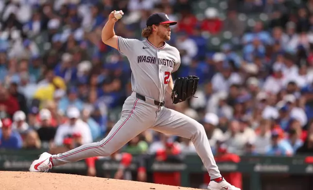 Washington Nationals Jake Irvin (27) pitches the ball during the third inning of a baseball game against the Chicago Cubs at Wrigley Field on Sunday, March 29, 2026, in Chicago. (AP Photo/Geoff Stellfox)