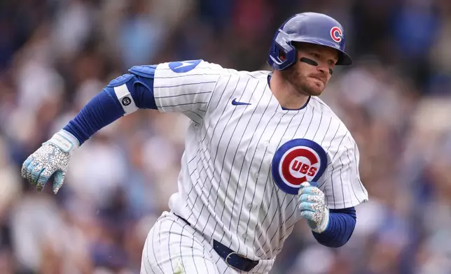 Chicago Cubs Ian Happ (8) rounds the bases after hitting a solo home run during the fourth inning of a baseball game against the Washington Nationals at Wrigley Field on Sunday, March 29, 2026, in Chicago. (AP Photo/Geoff Stellfox)