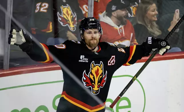 Calgary Flames' Blake Coleman celebrates his goal during the third period of an NHL hockey game against the Carolina Hurricanes in Calgary, Alberta, on Saturday, March 7, 2026. (Jeff McIntosh/The Canadian Press via AP)