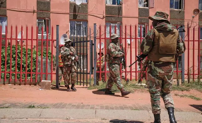 South African National Defense Forces deploy in the Riverlea township of Johannesburg, South Africa, Wednesday, March 11, 2026. (AP Photo/Themba Hadebe)