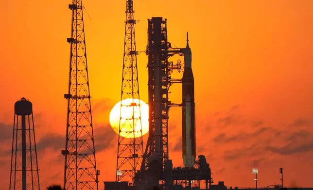 NASA's Space Launch System rocket with the Orion spacecraft set for the Artemis 2 mission is seen on Launch Complex 39B at sunrise at the Kennedy Space Center, Tuesday, March 24, 2026, in Cape Canaveral, Fla. (AP Photo/John Raoux)