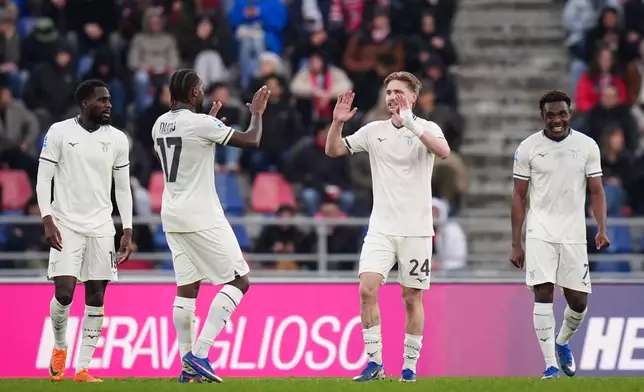 Lazio's Kenneth Taylor, second right, celebrates after scoring his side's second goal during the Serie A soccer match between FC Bologna and Lazio Rome in Bologna, Italy, Sunday, March 22, 2026. (Massimo Paolone/LaPresse via AP)