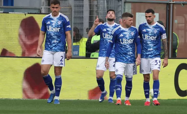 Como's Martin Baturina celebrates after scoring during the Serie A soccer match between Como and Pisa in Como, Italy, Sunday March 22, 2026. (Antonio Saia/LaPresse via AP)