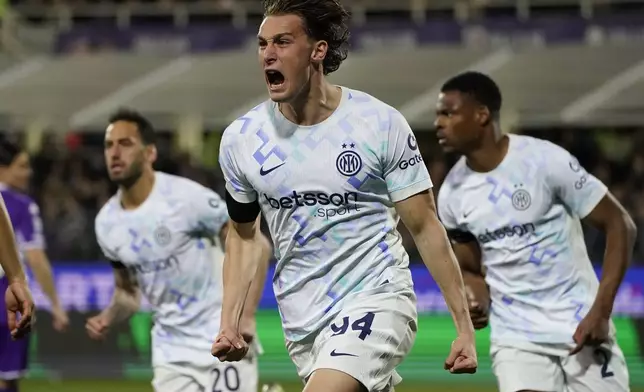 Inter's Pio Esposito celebrates after scoring the opening goal during the Serie A soccer match between Fiorentina and Inter Milan in Florence, Italy, Sunday, March 22, 2026. (Marco Bucco/LaPresse via AP)