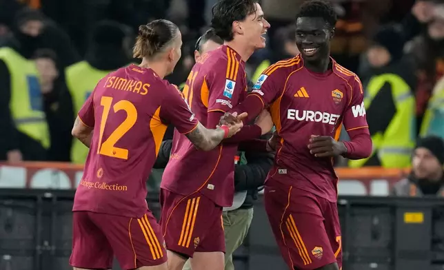 Roma players celebrate after a goal during the Serie A soccer match between Roma and Lecce in Rome, Sunday, March 22, 2026. (AP Photo/Gregorio Borgia)