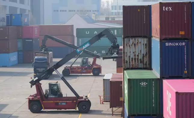 A crane unloads a container from a truck at the Uiwang ICD Terminal in Uiwang, South Korea, Thursday, March 12, 2026. (AP Photo/Ahn Young-joon)