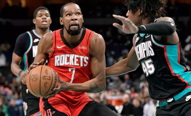 Houston Rockets forward Kevin Durant (7) handles the ball against Memphis Grizzlies forward GG Jackson II (45) in the first half of an NBA basketball game Friday, March 27, 2026, in Memphis, Tenn. (AP Photo/Brandon Dill)