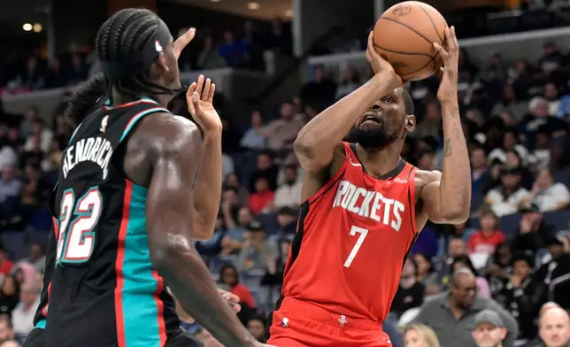 Houston Rockets forward Kevin Durant (7) looks to shoot against Memphis Grizzlies forward Taylor Hendricks (22) in the first half of an NBA basketball game Friday, March 27, 2026, in Memphis, Tenn. (AP Photo/Brandon Dill)