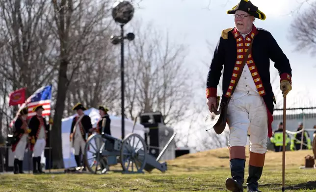 Crane's Continental Artillery reenactor Jeffrey Cooke takes part in an Evacuation Day ceremony marking the 1776 departure of British troops from the city during the American Revolutionary War, Tuesday, March 17, 2026, in Boston. (AP Photo/Robert F. Bukaty)