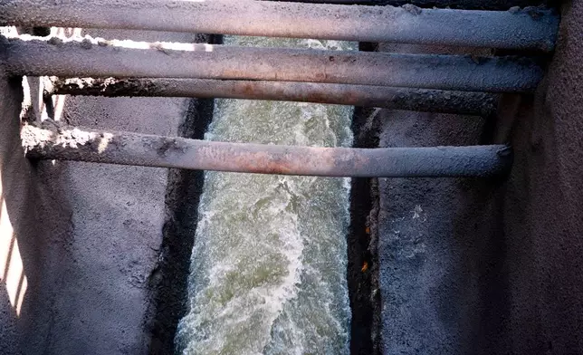 Raw sewage flows to an interceptor pipe along the C&amp;O Canal beside the Potomac River in Cabin John, Md., Saturday, March 14, 2026. (AP Photo/Cliff Owen)