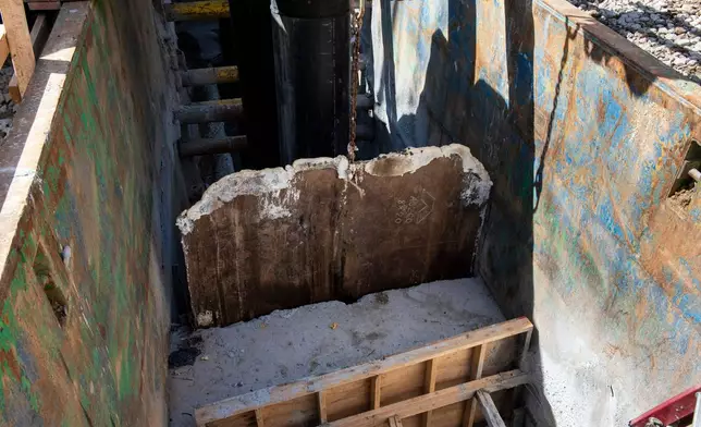 A gate is raised, allowing raw sewage to flow to an interceptor pipe along the C&amp;O Canal, beside the Potomac River, in Cabin John, Md., Saturday, March 14, 2026. (AP Photo/Cliff Owen)