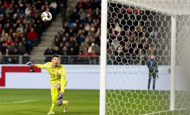 Switzerland's goalkeeper Gregor Kobel watches the ball go into the net for Germany's fourth goal during an international friendly soccer match between Switzerland and Germany in Basel, Switzerland, Friday, March 27, 2026. (Claudio Thoma/Keystone via AP)