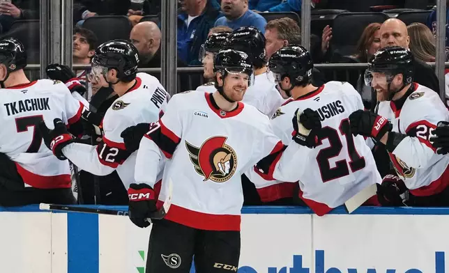 Ottawa Senators' Warren Foegele celebrates with teammates after scoring a goal during the second period of an NHL hockey game against the New York Rangers Monday, March 23, 2026, in New York. (AP Photo/Frank Franklin II)
