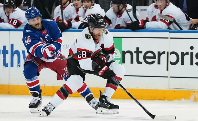 Ottawa Senators' Claude Giroux (28) drives past New York Rangers' Vincent Trocheck (16) during the second period of an NHL hockey game Monday, March 23, 2026, in New York. (AP Photo/Frank Franklin II)