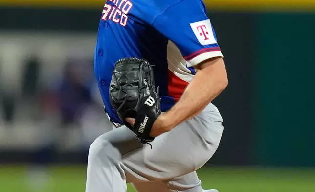 Puerto Rico's pitcher Seth Lugo pitches in the first inning against Colombia during the first inning of a World Baseball Classic game in San Juan, Puerto Rico, Friday, March 6, 2026. (AP Photo/Fernando Llano)