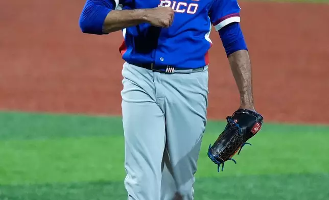Puerto Rico pitcher Edwin Diaz reacts at the end of a World Baseball Classic game against Colombia in San Juan, Puerto Rico, Friday, March 6, 2026. (AP Photo/Fernando Llano)