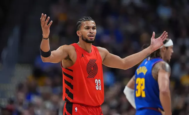 Portland Trail Blazers forward Toumani Camara (33) argues after he was called for a foul in the first half of an NBA basketball game against the Denver Nuggets, Sunday, March 22, 2026, in Denver. (AP Photo/David Zalubowski)