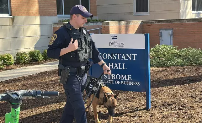 Police are present at Constant Hall, where yesterday shooting occurred on Friday, March 13, 2026 at Old Dominion Universiy in Norfolk, Va. (AP Photo/Allen G. Breed).