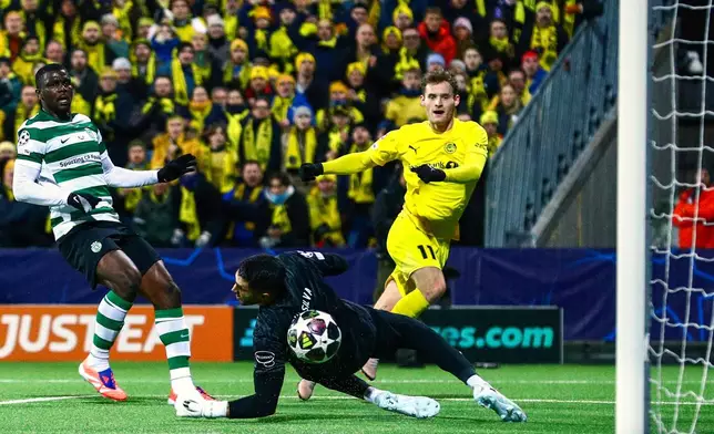 Bodo/Glimt's Ole Didrik Blomberg, right, scores their side's second goal of the game during the Champions League soccer match between Bodo/Glimt and Sporting Lisbon, in Bodo, Norway, Wednesday March 11, 2026. (Fredrik Varfjell/NTB Scanpix via AP)