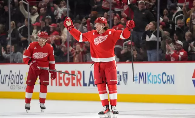 Detroit Red Wings defenseman Moritz Seider (53) celebrates his goal against the Calgary Flames in the second period of an NHL hockey game Monday, March 16, 2026, in Detroit. (AP Photo/Paul Sancya)