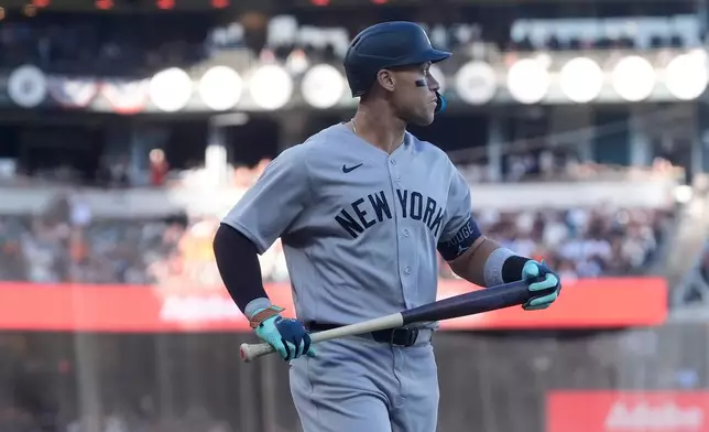 New York Yankees' Aaron Judge reacts after striking out against the San Francisco Giants during the first inning of a baseball game in San Francisco, Wednesday, March 25, 2026. (AP Photo/Jeff Chiu)