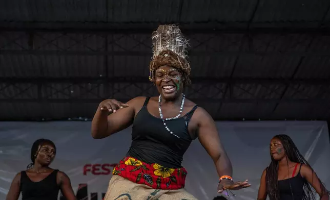 A dancer performs on stage during rapper Clem Cleopatre's concert in Goma, Democratic Republic of Congo, Sunday, March 29, 2026. (AP Photo/Moses Sawasawa)