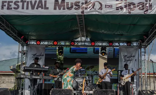 Rapper Clem Cleopatre performs for the crowd in Goma, Democratic Republic of Congo, Saturday, March 28, 2026. (AP Photo/Moses Sawasawa)