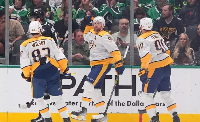 Nashville Predators center Steven Stamkos (91) reacts to scoring a goal in front of teammates center Ryan O'Reilly (90) and defenseman Adam Wilsby (83) during the first period of an NHL hockey game against the Dallas Stars Saturday, Feb. 28, 2026, in Dallas. (AP Photo/LM Otero)