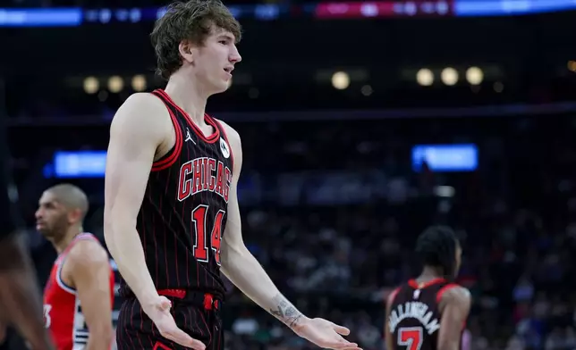 Chicago Bulls forward Matas Buzelis (14) reacts during the first half of an NBA basketball game against the Los Angeles Clippers, Friday, March 13, 2026, in Inglewood, Calif. (AP Photo/Ryan Sun)
