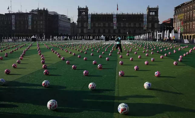 Soccer balls sit ahead of an event to set a Guinness World Record for the "largest soccer class" at the Zocalo in Mexico City, Sunday, March 15, 2026. (AP Photo/Marco Ugarte)