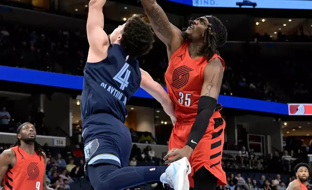 Memphis Grizzlies guard Walter Clayton Jr. (4) shoots against Portland Trail Blazers center Robert Williams III (35) in the first half of an NBA basketball game, Wednesday, March 4, 2026, in Memphis, Tenn. (AP Photo/Brandon Dill)
