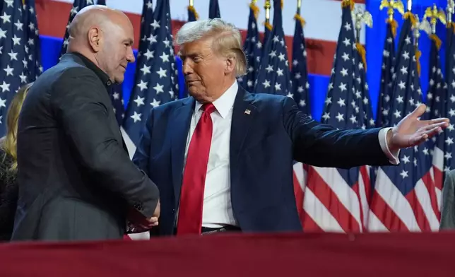 FILE - Republican presidential nominee former President Donald Trump talks with UFC CEO Dana White at an election night watch party at the Palm Beach Convention Center, Nov. 6, 2024, in West Palm Beach, Fla. (AP Photo/Evan Vucci, File)