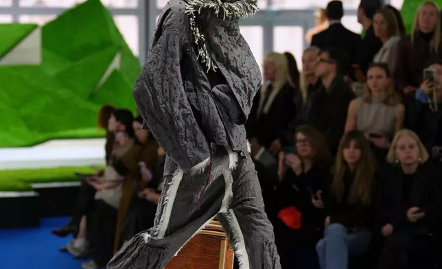 A model wears a creation from the Louis Vuitton Fall/Winter 2026-2027 Women's collection presented in Paris, Tuesday, March 10, 2026. (AP Photo/Aurelien Morissard)