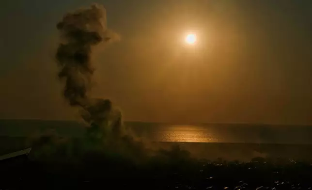 Smoke rise from an Israeli airstrike in Dahiyeh, Beirut's southern suburbs, at sunset in Beirut, Lebanon, Tuesday, March 10, 2026. (AP Photo/Bilal Hussein)